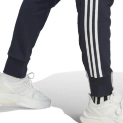 ADIDAS Essentials French Terry Tapered Cuff 3-Stripes Pantalone Da Allenamento Uomini - Blu Scuro, Bianco -Vendite Racchette da tennis 17902000 17